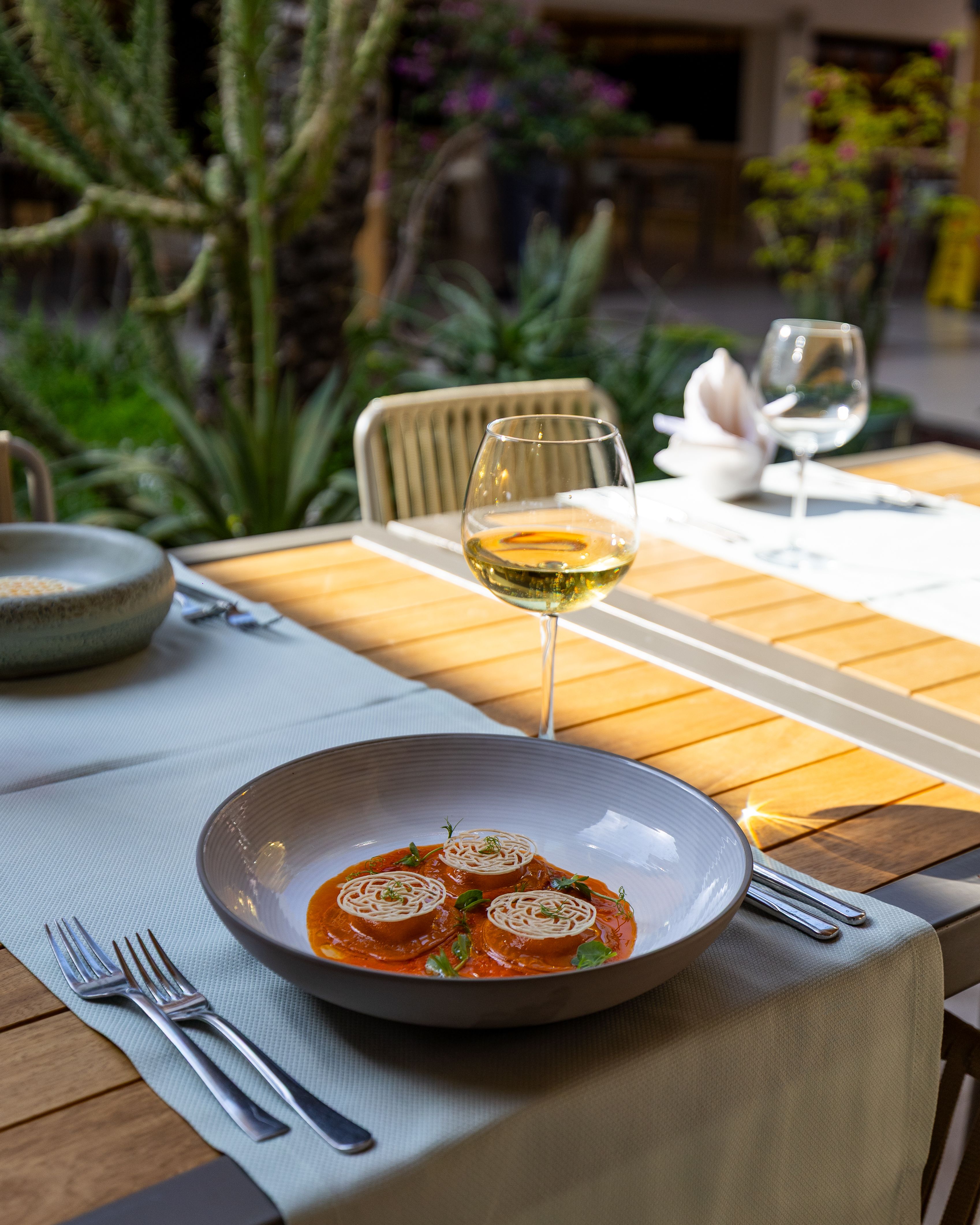 A restaurant table set for a meal, ready for guests